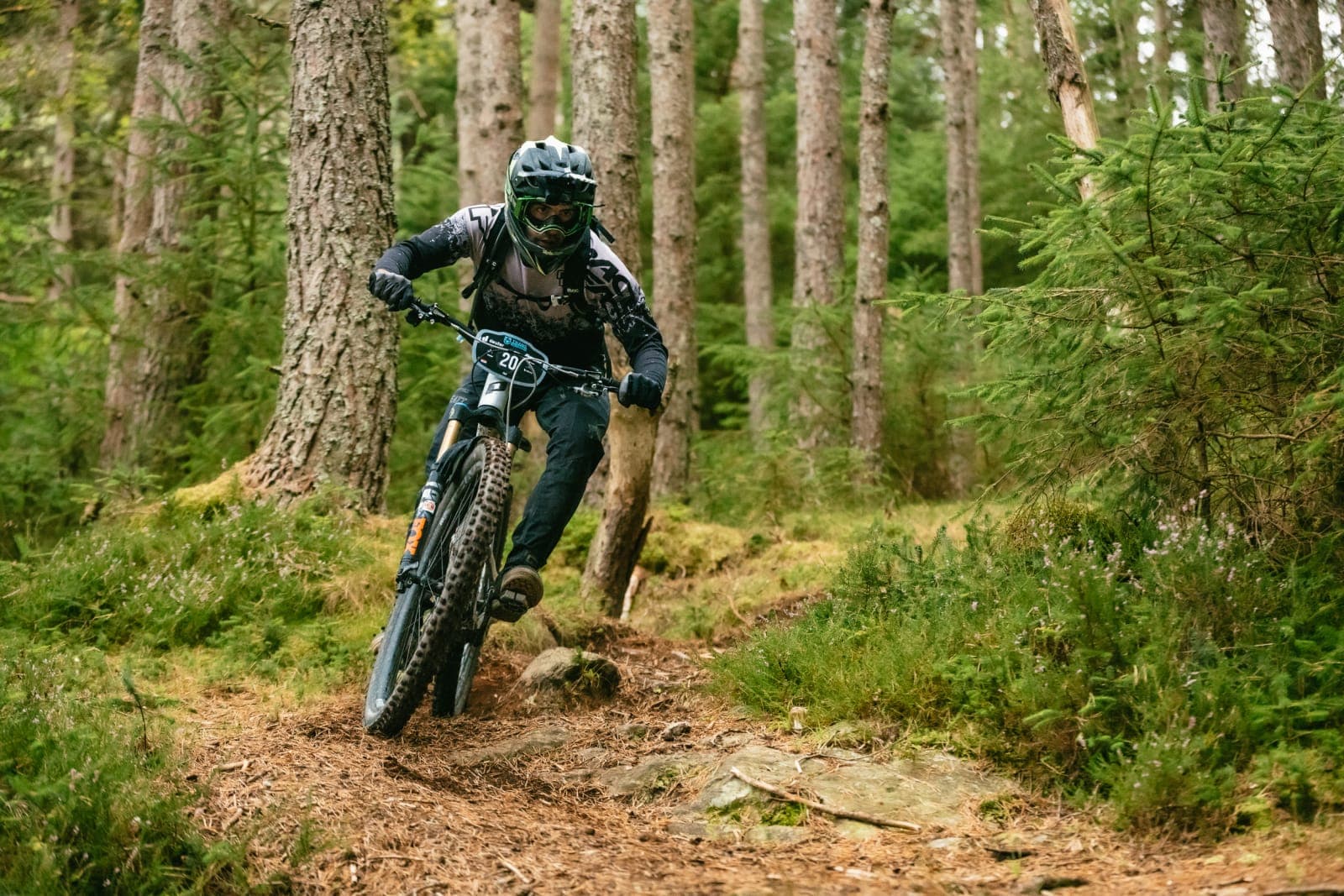 Filip Radulovic, bib 20, riding a Scottish forest stage at Trans Caledonia 2026.