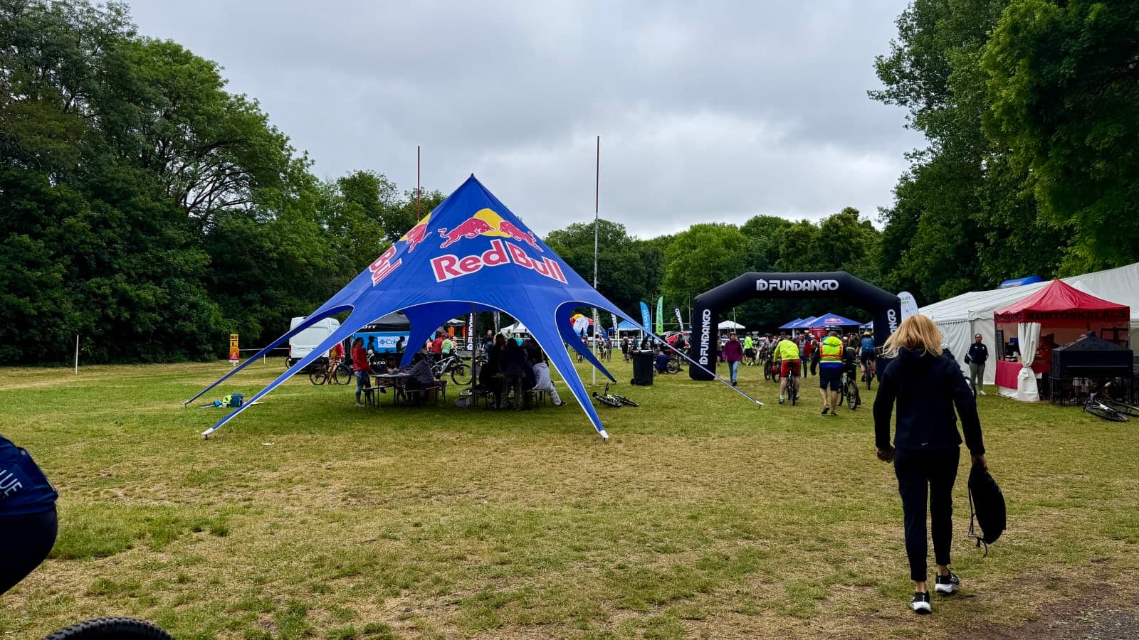 Start village at Crosskovacsi MTB Marathon 2026 with riders gathering under sponsor tents.