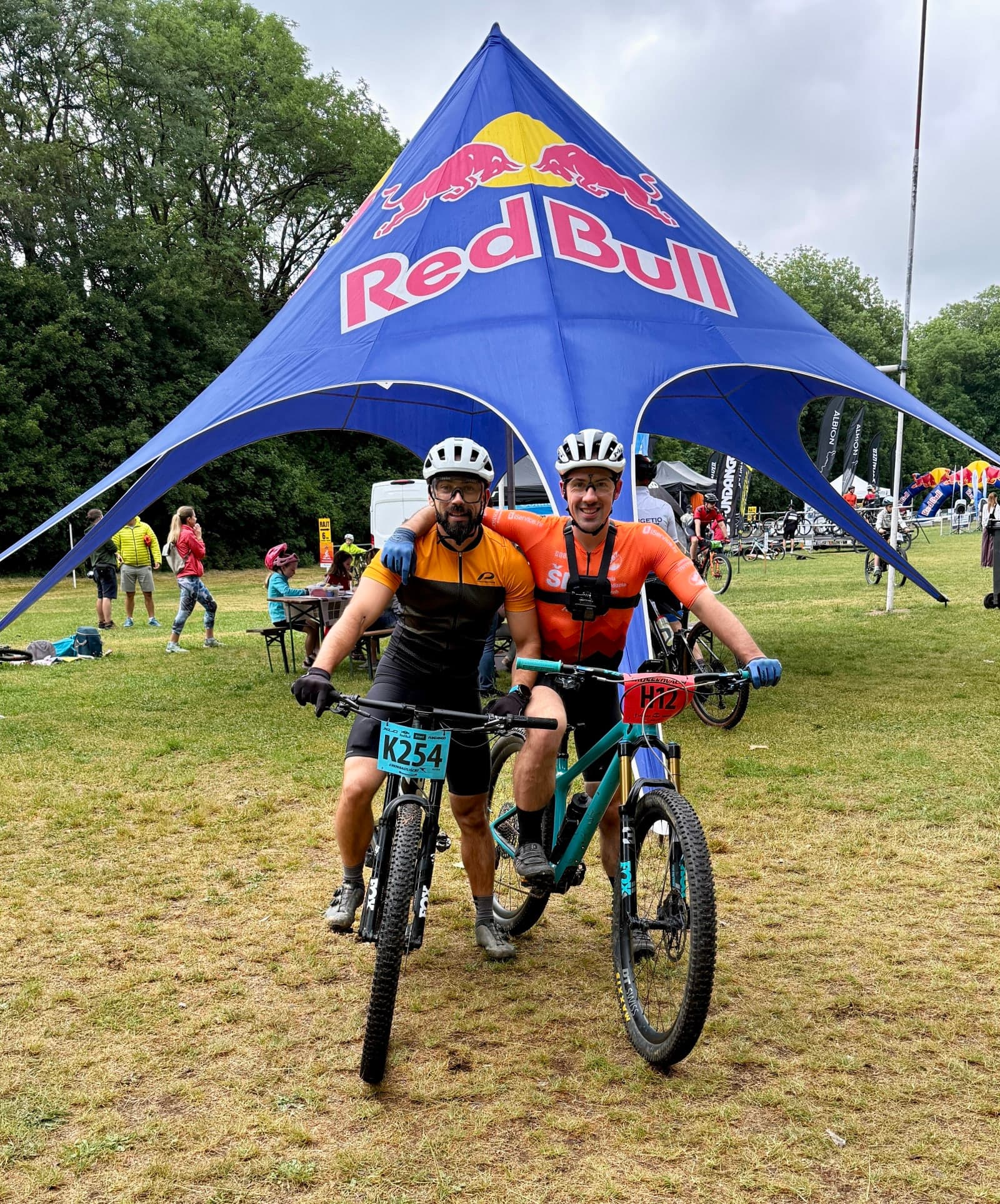 Filip Radulovic and another rider before Crosskovacsi MTB Marathon 2026 under the Red Bull tent.