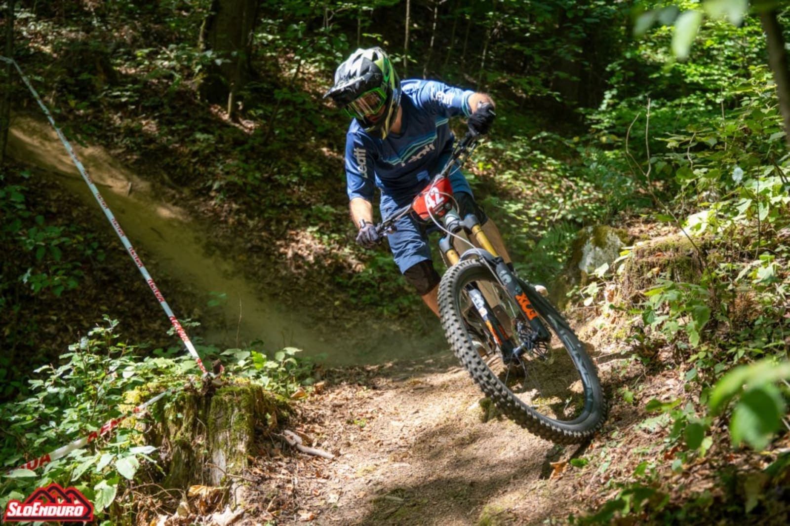 Filip Radulovic riding a technical forest trail during SloEnduro Krokar 2026 in Dobrna, Slovenia.
